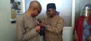 Barr Eze Presented with a badge